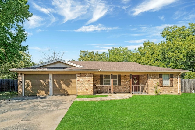 ranch-style house featuring a garage and a front lawn