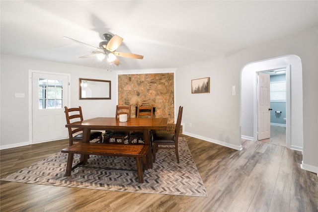 dining area featuring dark hardwood / wood-style flooring and ceiling fan