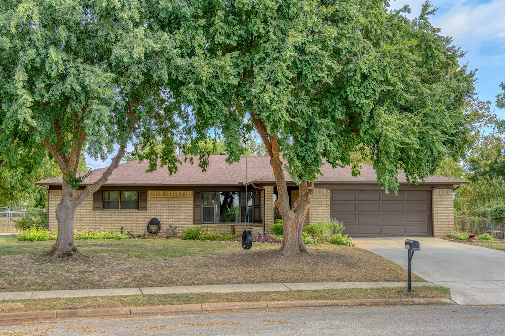 single story home featuring a garage