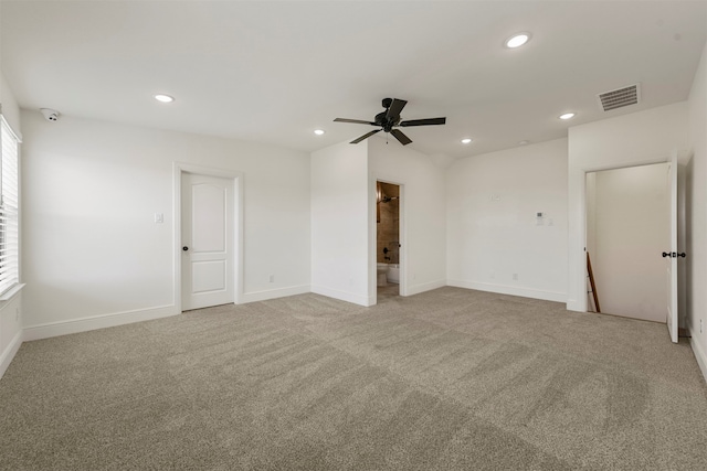 carpeted spare room featuring ceiling fan