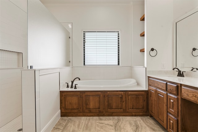 bathroom featuring vanity, ornamental molding, and separate shower and tub