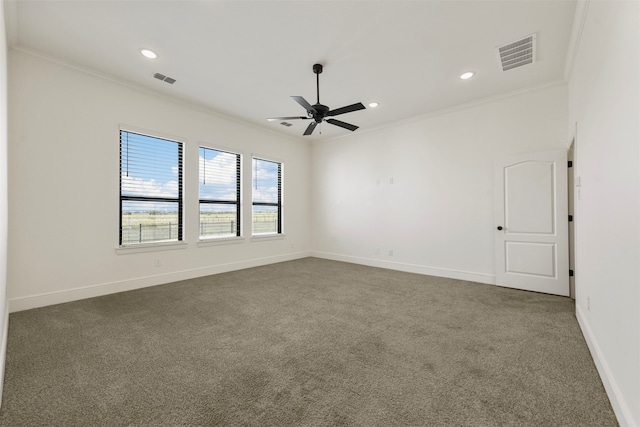 carpeted empty room with ceiling fan and ornamental molding