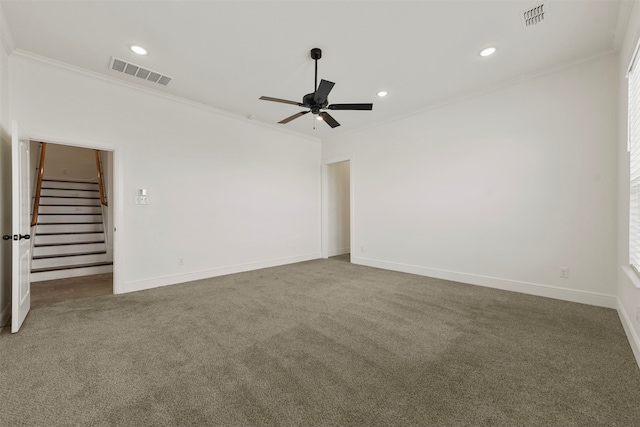 carpeted spare room with ornamental molding and ceiling fan