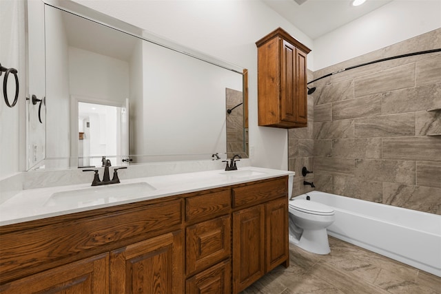 full bathroom featuring vanity, toilet, and tiled shower / bath combo