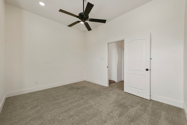 spare room with light carpet and ceiling fan