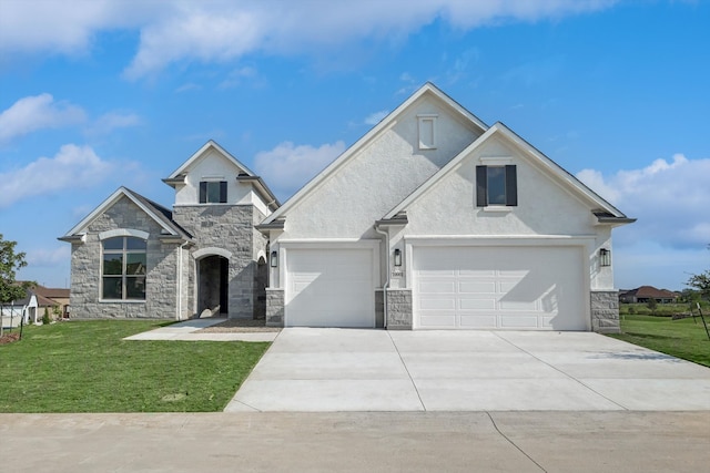 view of front facade with a garage and a front lawn