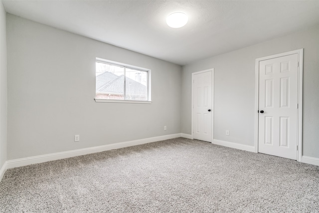 unfurnished room with carpet