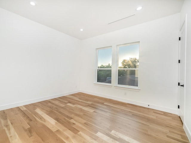 spare room featuring light hardwood / wood-style flooring