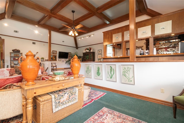 interior space with ceiling fan, coffered ceiling, beam ceiling, and carpet