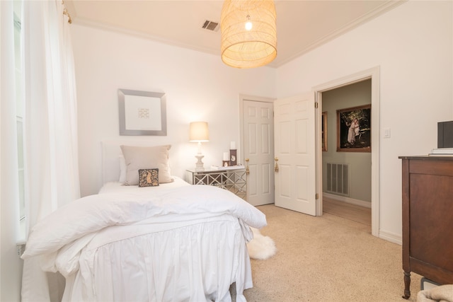 carpeted bedroom with crown molding