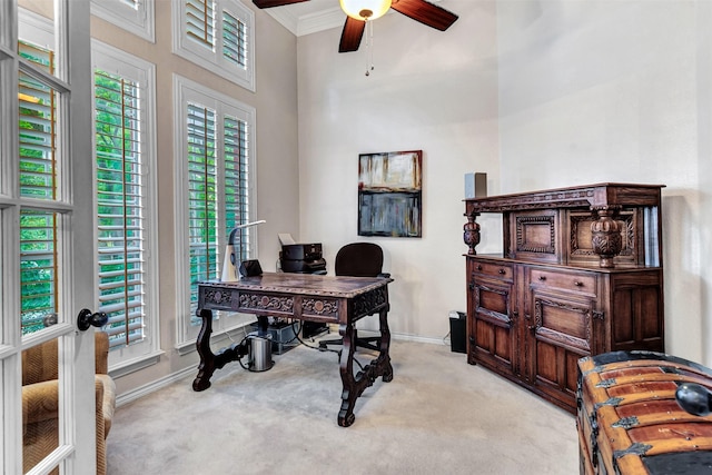 home office featuring ceiling fan, light colored carpet, crown molding, and french doors