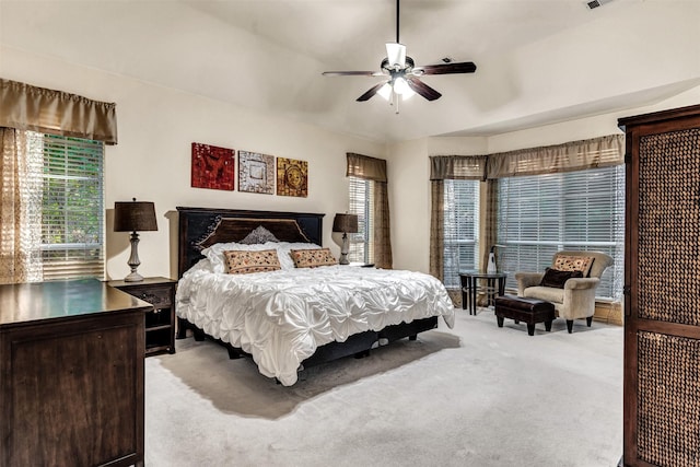 bedroom with ceiling fan and light colored carpet