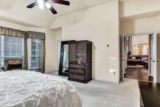 bedroom featuring carpet flooring, ceiling fan, and lofted ceiling