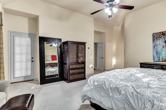 bedroom with ceiling fan, light carpet, and lofted ceiling