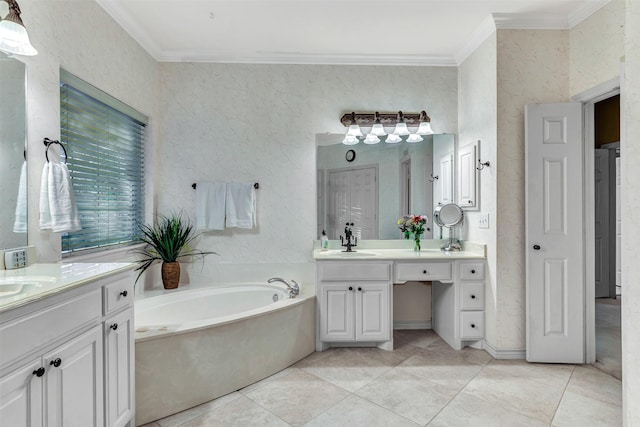 bathroom featuring tile patterned floors, vanity, crown molding, and a tub