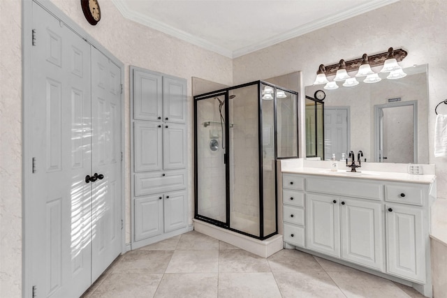 bathroom with vanity, tile patterned floors, a shower with shower door, and crown molding