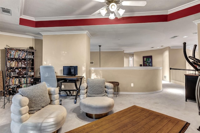 carpeted living room with a raised ceiling, ceiling fan, and crown molding