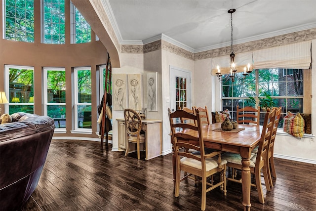 dining room featuring a chandelier, dark wood-type flooring, and ornamental molding