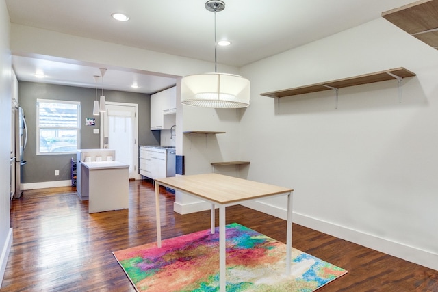 unfurnished dining area with dark hardwood / wood-style floors