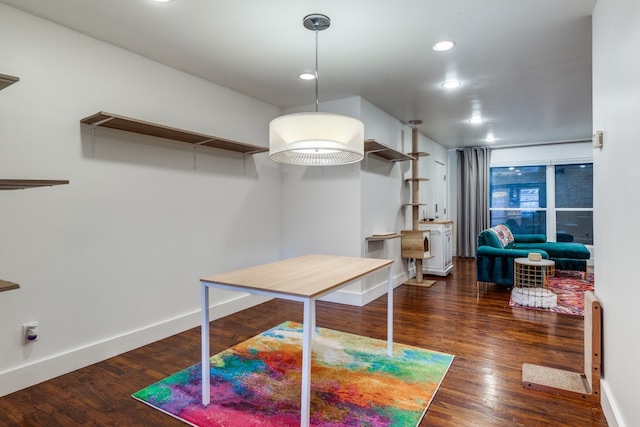 dining room with dark hardwood / wood-style flooring