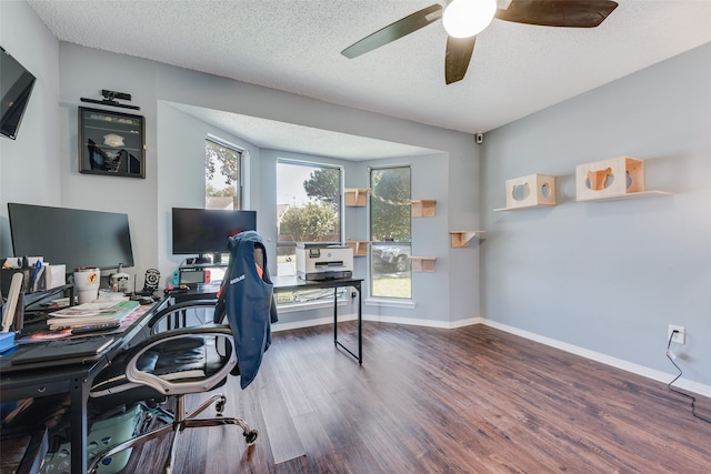 office featuring ceiling fan, hardwood / wood-style flooring, and a textured ceiling