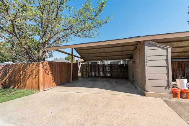 view of parking / parking lot with a carport