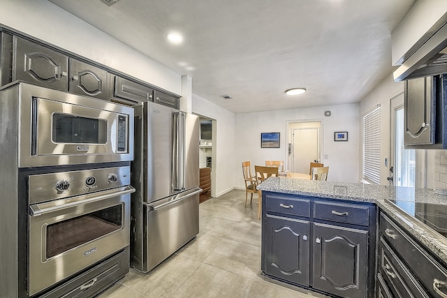 kitchen featuring appliances with stainless steel finishes and light tile patterned flooring