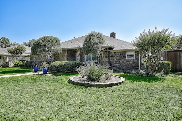 ranch-style home with a front yard