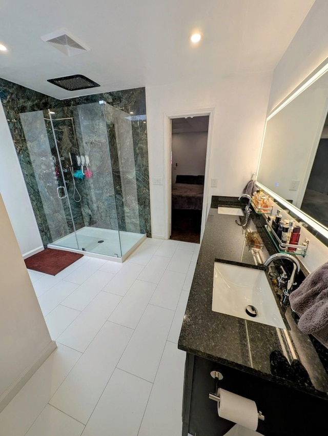 bathroom featuring vanity, tile patterned floors, and an enclosed shower