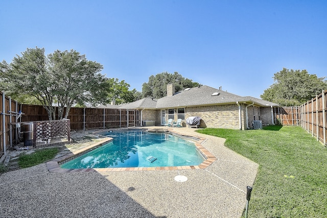 view of pool featuring a patio area, central AC unit, and a lawn