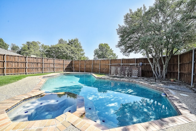 view of swimming pool featuring an in ground hot tub