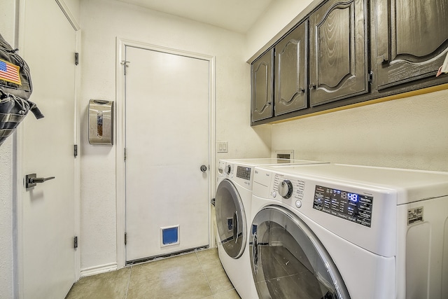 laundry room featuring cabinets and independent washer and dryer