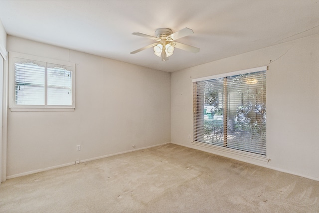 carpeted empty room with ceiling fan