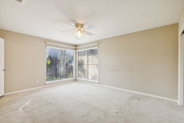 empty room with light carpet and ceiling fan