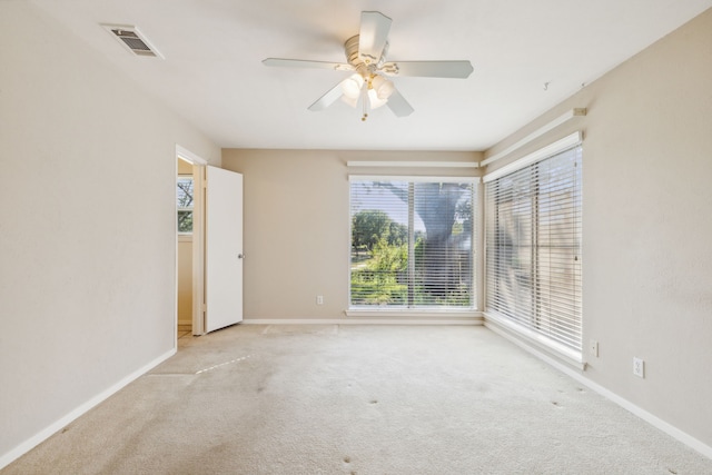 carpeted empty room with ceiling fan