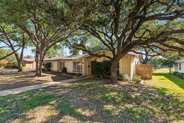 ranch-style house with a front yard