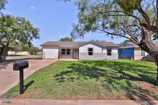 single story home with a front lawn and a garage