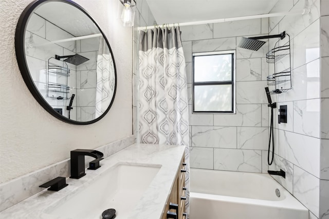 bathroom featuring shower / bath combo with shower curtain and vanity