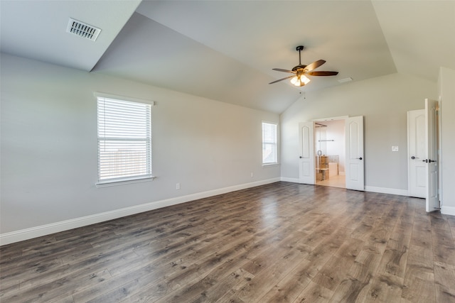 unfurnished living room with ceiling fan, vaulted ceiling, and dark hardwood / wood-style flooring