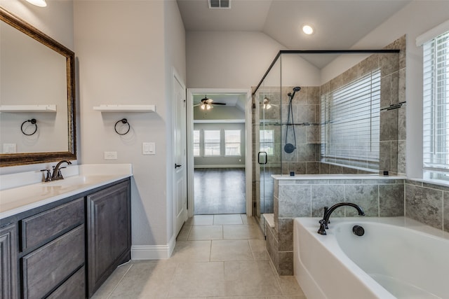 bathroom with ceiling fan, tile patterned flooring, vanity, plus walk in shower, and vaulted ceiling