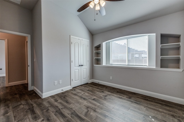 unfurnished bedroom with ceiling fan, dark hardwood / wood-style floors, vaulted ceiling, and a closet