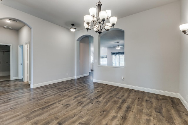 unfurnished living room with dark hardwood / wood-style flooring, ceiling fan, and a fireplace