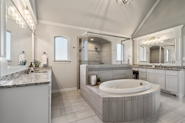 bathroom with tile patterned flooring, vaulted ceiling, crown molding, vanity, and independent shower and bath