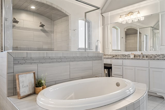 bathroom with lofted ceiling, vanity, crown molding, and plus walk in shower