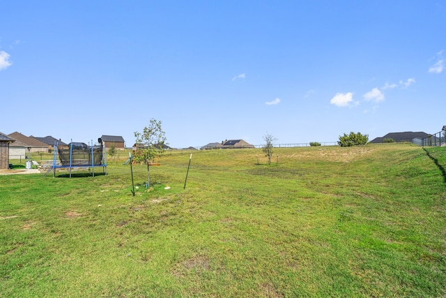 view of yard with a trampoline