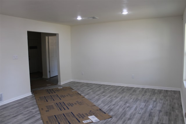 spare room featuring dark hardwood / wood-style floors