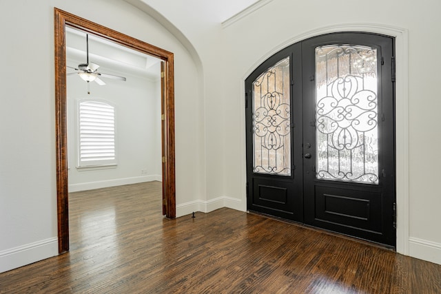 foyer with french doors, dark wood-type flooring, and ceiling fan