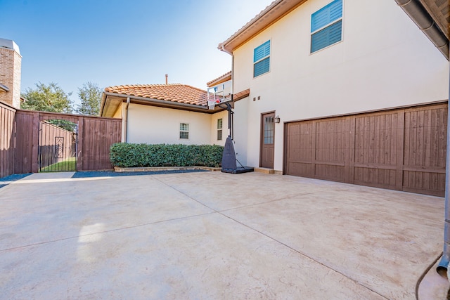 view of side of property featuring a garage