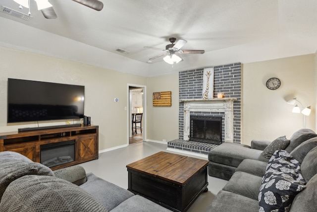 living room featuring a brick fireplace, visible vents, and ceiling fan