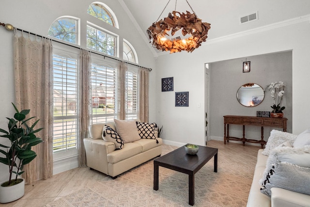 tiled living room featuring high vaulted ceiling, crown molding, and plenty of natural light